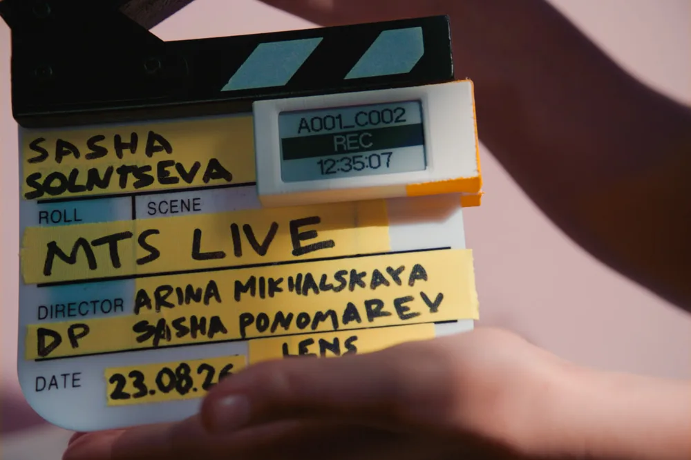 Cineink e-paper display mounted on a film slate during a shoot